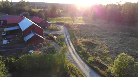 Drone-footage-flying-over-a-small-farm-in-Sweden