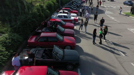 Aerial-view-over-row-of-parked-BMW-series-e30-classic-cars-at-Manresa-fan-meeting