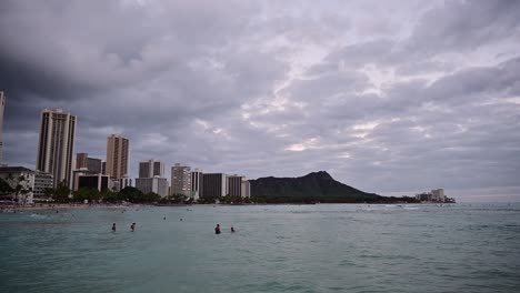Honolulu,-Hawaii---December-29,-2022:-View-of-Waikiki-Beach-at-dusk-with-Diamond-Head-volcano-in-the-distance