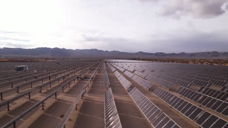 Aerial-Drone-Footage-of-Solar-Panel-Field-in-Joshua-Tree-National-Park-on-a-Sunny-Day,-horizontal-dolly-shot