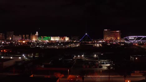 Aerial-close-up-panning-shot-of-the-south-Las-Vegas-Strip-at-night