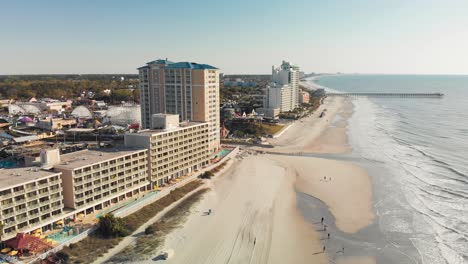 Top-view-of-the-pristine-beaches-of-Myrtle-Beach-showing-seaside-town-filled-with-colorful-resorts-and-hotels