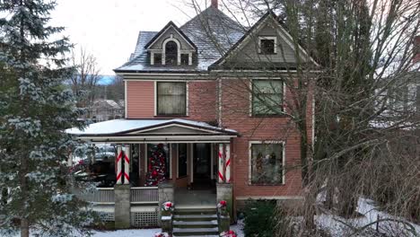 Slow-aerial-rising-shot-of-victorian-home-decorated-for-Christmas