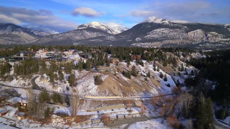 Aerial-drone-view-of-a-large-house-on-top-of-a-bluff-over-looking-Lake-Invermere-in-British-Columbia,-Canada