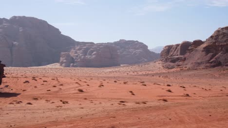 Planet-Mars-like-desert-landscape-of-Wadi-Rum-in-Jordan-with-rugged,-red-sandstone,-rocky-mountains
