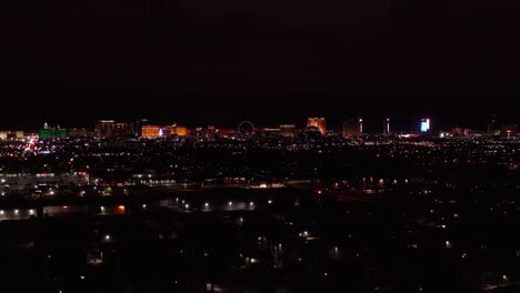 Super-wide-descending-and-panning-aerial-shot-of-the-Last-Vegas-Strip-at-night