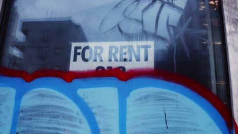 For-Rent-sign-covered-by-Graffiti