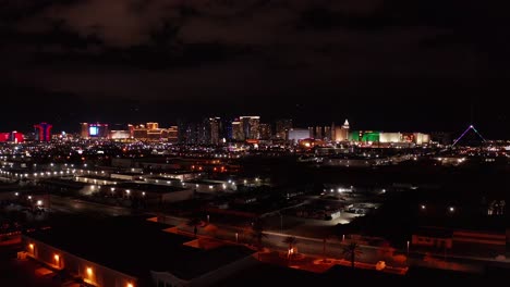 Aerial-wide-dolly-shot-of-the-central-and-south-areas-of-the-Las-Vegas-Strip-at-night