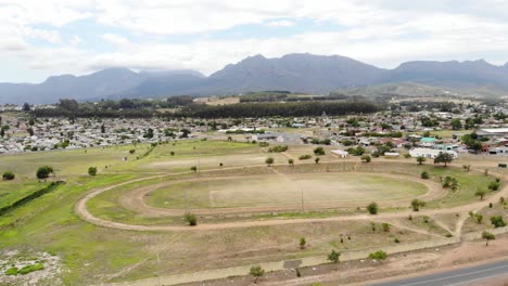 A-drone-shot-of-a-township-dirt-athletics-track-in-Paarl