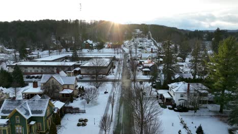 High-aerial-of-large-houses-in-snow-covered-neighborhood