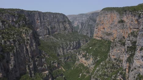 An-aerial-view-of-the-Vikos-gorge-canyon,-in-Epirus,-Greece-with-the-drone-moving-forward