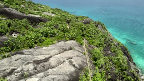 Drone-over-national-park,-anse-major-nature-trail,-rock-formations