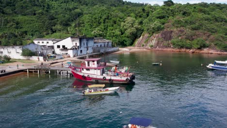 Labors-Loading-Trash-In-Garbage-Boat-Anchored-At-ilha-Grande-Island,-Rio-de-Janeiro,-Brazil