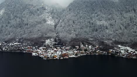 Footage-filmed-with-a-drone-over-a-lake-by-a-town-called-Hallstatt-in-Austria-in-Europe