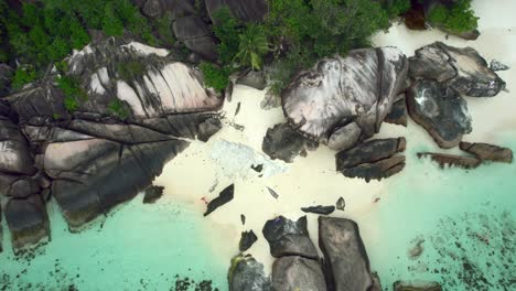Mahe-Seychelles-baie-lazare-people-on-the-beach-and-rock-boulders-1