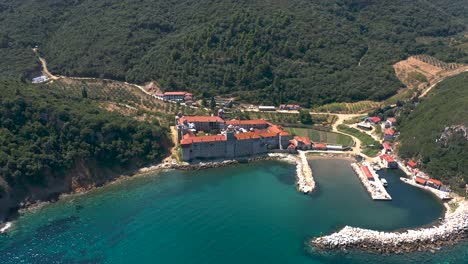 An-aerial-view-of-a-coastal-medieval-monastery-in-the-Holy-Mountain-in-Greece