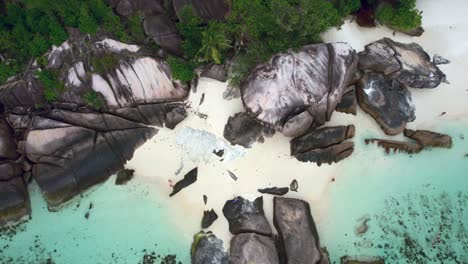 Mahe-Seychelles-baie-lazare-people-on-the-beach-and-rock-boulders