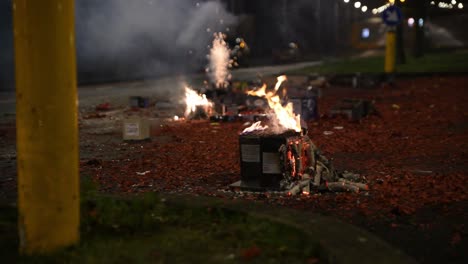 Multiple-boxes-of-fireworks-launched-from-middle-of-the-road-as-cake-cluster-burns-out