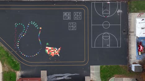Top-down-aerial-of-asphalt-playground-at-American-school