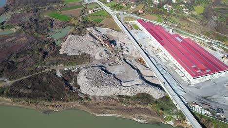 Sand-quarry-beside-Shkumbini-river-in-Albania,-ecological-disaster-by-digging-riverbed
