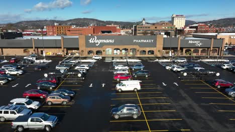 Slow-aerial-push-in-on-Wegmans-store-on-snow-covered-day-in-Williamsport-PA