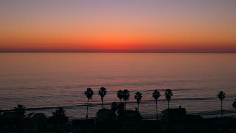 Sunset-Drone-Video-of-Palm-Trees-at-Beach-in-Oceanside,-California