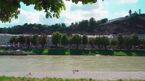 A-beautiful-and-sunny-day-at-Salzach-river-bank-in-the-center-of-Salzburg