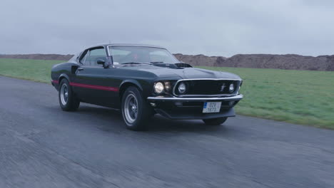 Ford-Mustang-Mach-1-Sport-Car-on-Road,-Old-timer-in-Perfect-Condition