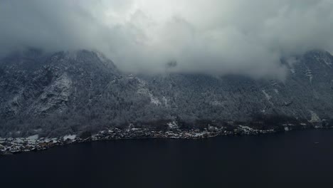 Footage-filmed-with-a-drone-over-a-lake-by-a-town-called-Hallstatt-in-Austria-in-Europe