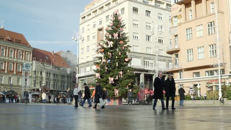 People-walking-through-the-Jelačića-square-in-Zagreb,-Croatia-during-the-Christmas-holidays