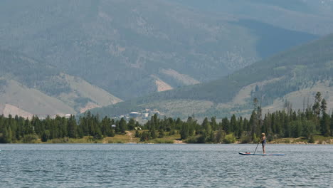 Two-people-riding-paddleboards-across-Lake-Dillon-in-Colorado's-Frisco-Adventure-Park