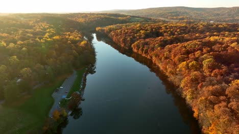 Aerial-reveal-of-calm-lake-among-rural-Appalachian-countryside