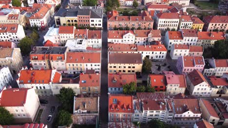 AERIAL-Backwards-Fly-By-over-the-Old-Town-in-Klaipeda,-Lithuania