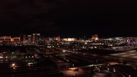 Aerial-wide-rising-shot-of-the-south-Las-Vegas-Strip-at-night