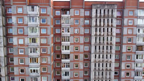 AERIAL-Close-Fly-By-of-a-Residential-Apartment-Building-in-Klaipeda,-Lithuania