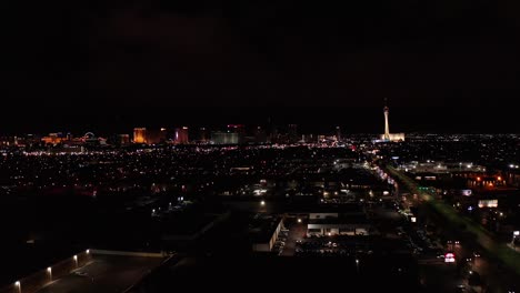 Super-wide-aerial-dolly-shot-of-the-central-and-north-areas-of-the-Las-Vegas-Strip-at-night
