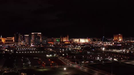 Wide-panning-aerial-shot-from-the-south-to-the-central-Las-Vegas-Strip-at-night