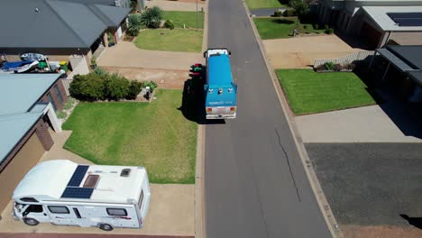 Mulwala,-New-South-Wales,-Australia---10-July-2022:-Aerial-View-of-Garbage-Truck-Picking-Up-Domestic-Rubbish-Bins-in-a-Mulwala-Street-in-NSW-Australia