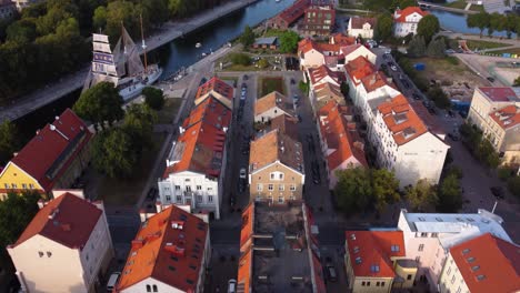 AERIAL-Revealing-Shot-of-Klaipeda-Old-Town-and-the-River,-Lithuania