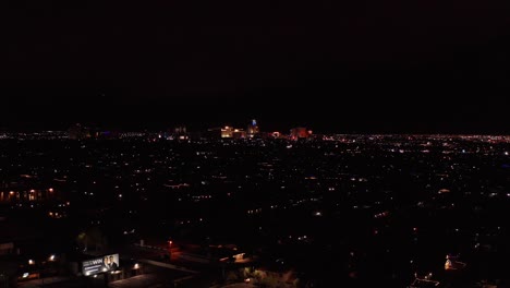 Aerial-super-wide-shot-of-downtown-Las-Vegas-from-the-Strip-at-night