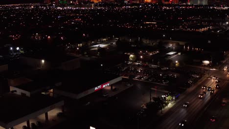 Super-wide-tilting-up-aerial-shot-of-the-Las-Vegas-Strip-at-night