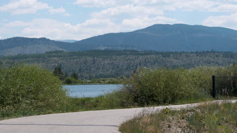 Cyclists-traveling-around-Lake-Dillon-on-a-warm-summer-day-in-Colorado's-Rocky-Mountains