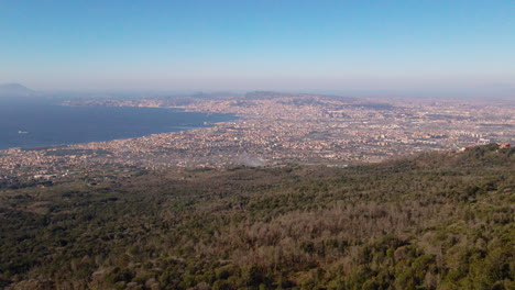 Aerial-view-across-Amalfi,-Italy-Naples-cityscape-coastline-across-the-horizon