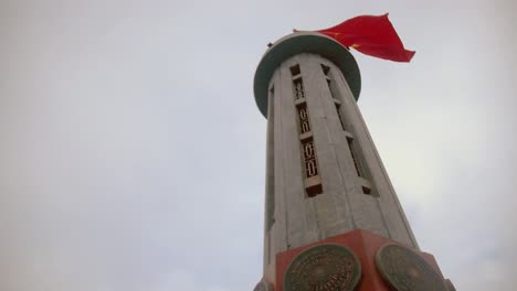 looking-up-to-Lũng-Cú-Flag-Tower-with-Vietnamese-flag-fluttering-in-the-wind