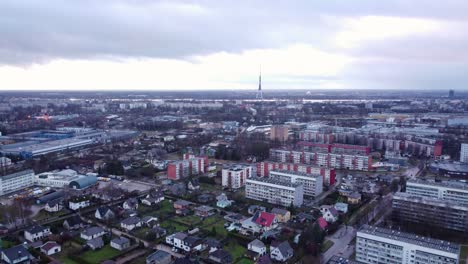 Apartment-buildings-in-Darzciems,-Riga-on-an-overcast-day,-aerial-view-on-city-with-TV-tower