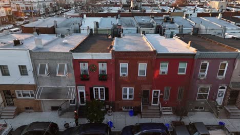 Aerial-truck-shot-of-row-houses-decorated-for-Christmas