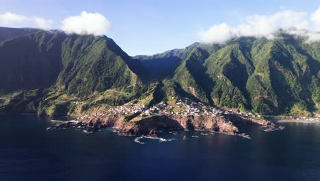 Aerial-mountain-panorama-of-epic-volcanic-green-coast-in-Seixal,-Madeira
