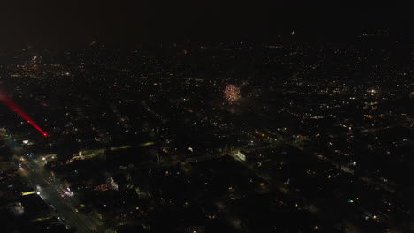 During-fireworks-on-the-Fourth-of-July,-someone-tries-to-blind-a-drone-with-a-laser