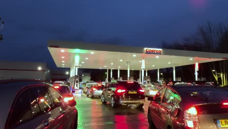14-January-2023---Drivers-Queuing-Up-To-Fill-Up-At-Costco-Petrol-Station-In-Watford-At-Night