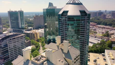 Slowly-descending-aerial-shot-of-tall-buildings-over-downtown-Buckhead-in-Atlanta,-GA